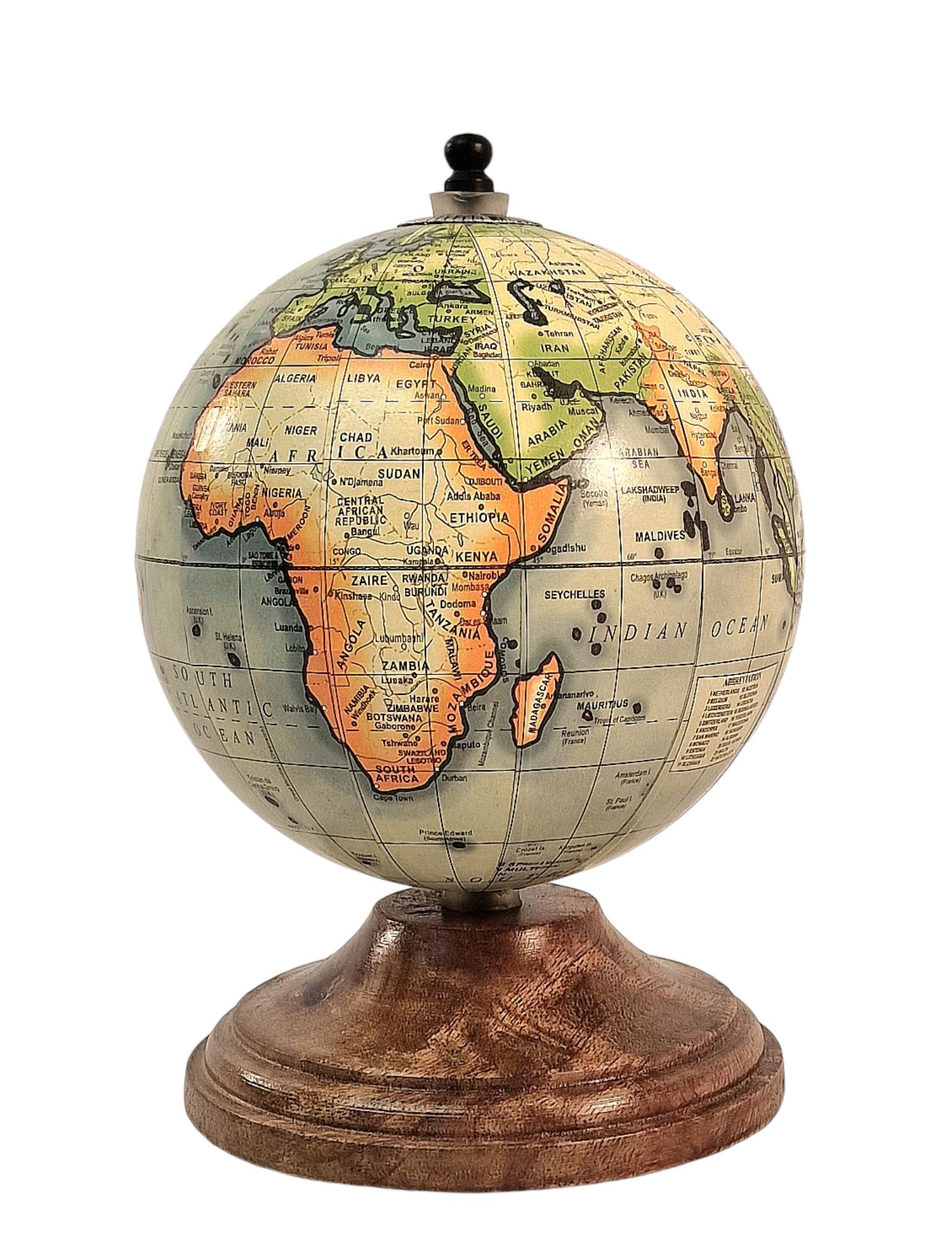 Vintage-style globe on a wooden stand, depicting continents and oceans with detailed labeling.