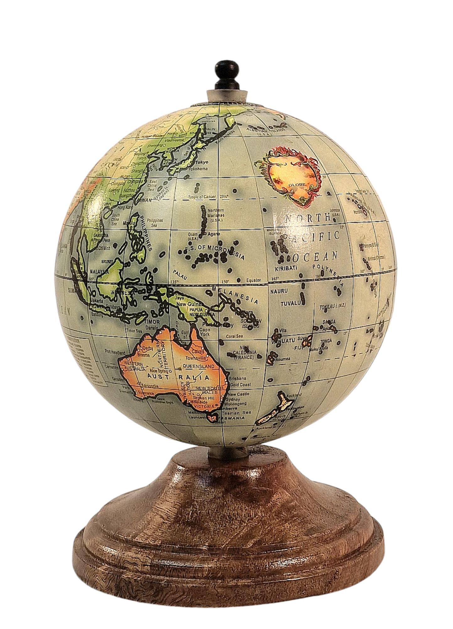 Vintage-style globe on a wooden stand, depicting continents and oceans with detailed labeling.