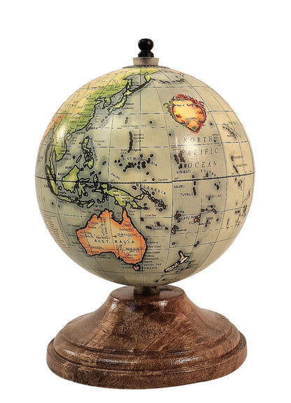 Vintage-style globe on a wooden stand, depicting continents and oceans with detailed labeling.