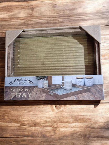 Wooden serving tray with a light grey/beige textured glass surface, displayed on a wooden surface.