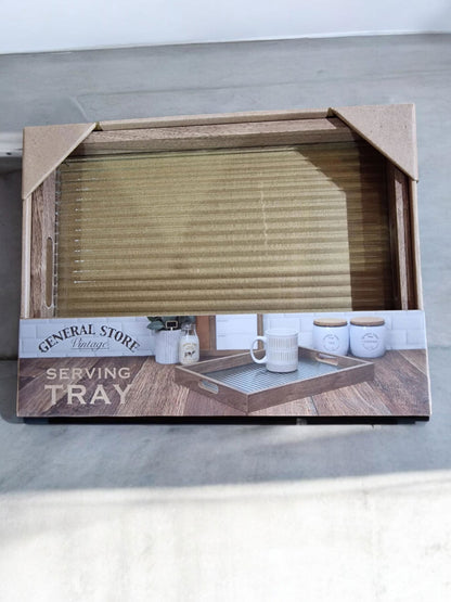 Wooden serving tray with a light grey/beige textured glass surface, displayed on a wooden surface.