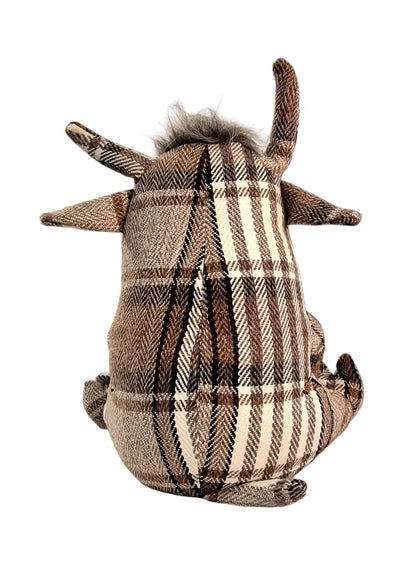 Grey tartan fabric bull doorstop with soft horns and button eyes, used as a charming and functional home decor accessory