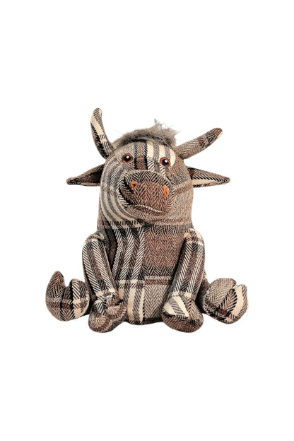 Grey tartan fabric bull doorstop with soft horns and button eyes, used as a charming and functional home decor accessory
